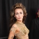 MILEY CYRUS RESPONDS CYRUS RESPONDS TO REPORTS THAT HER DRESS IN THE "FLOWERS" VIDEO DISREGARDED JENNIFER LAWRENCE